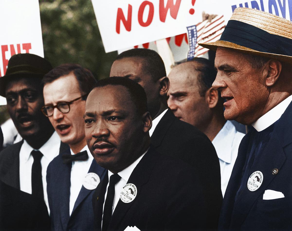 Montage of 1960s cultural icons including Vietnam War protests, civil rights marches, and portraits of Martin Luther King Jr. and Robert F. Kennedy