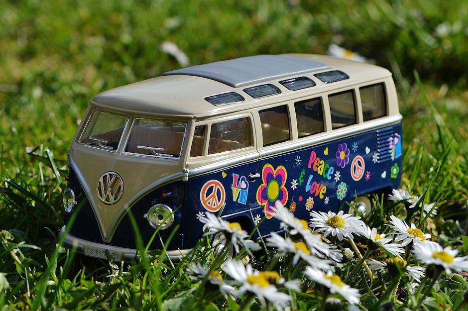 A colorful Volkswagen van decorated with peace signs and flowers
