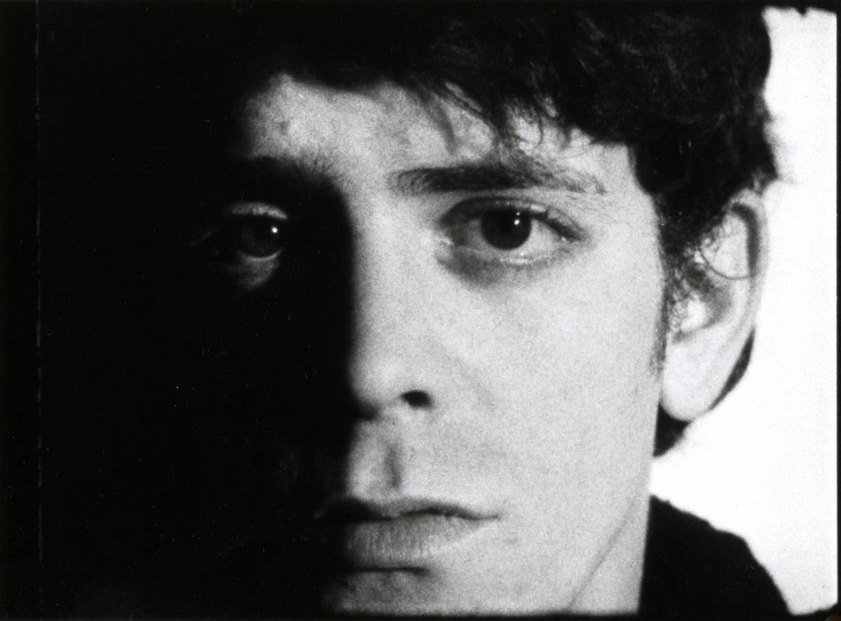 Lou Reed as a young man in the 1960s, looking thoughtful and creative