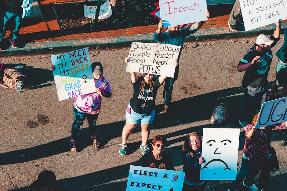 A diverse group of modern protesters marching for civil rights and equality