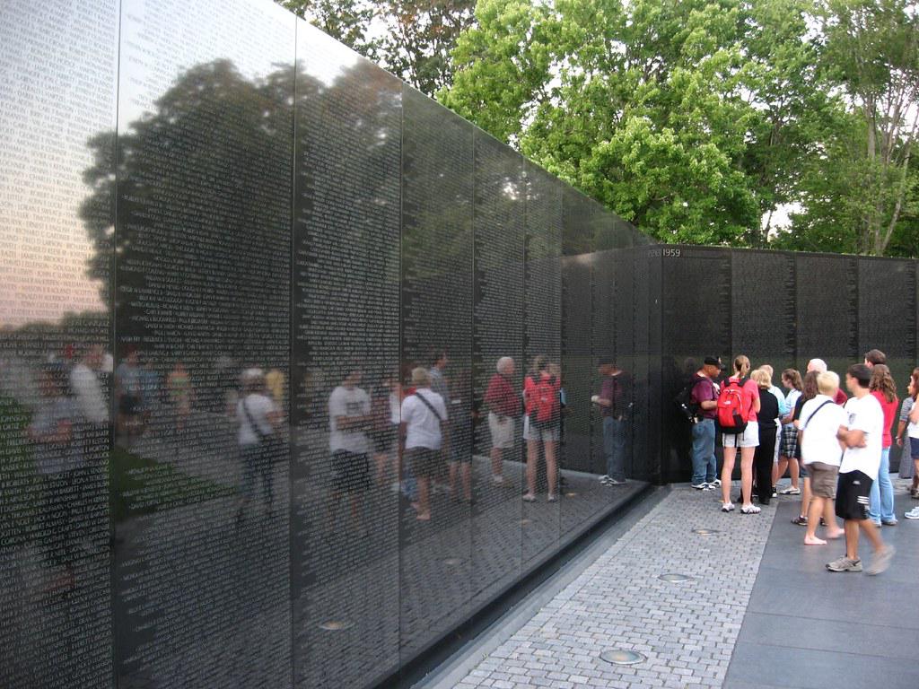 Reflection of a veteran in the Vietnam Veterans Memorial